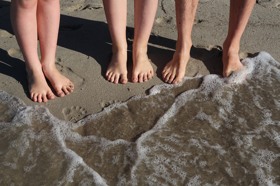 children on beach family holiday