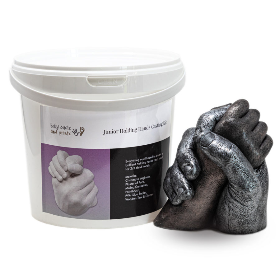 Junior Casting Kit bucket next to child and adult hand cast