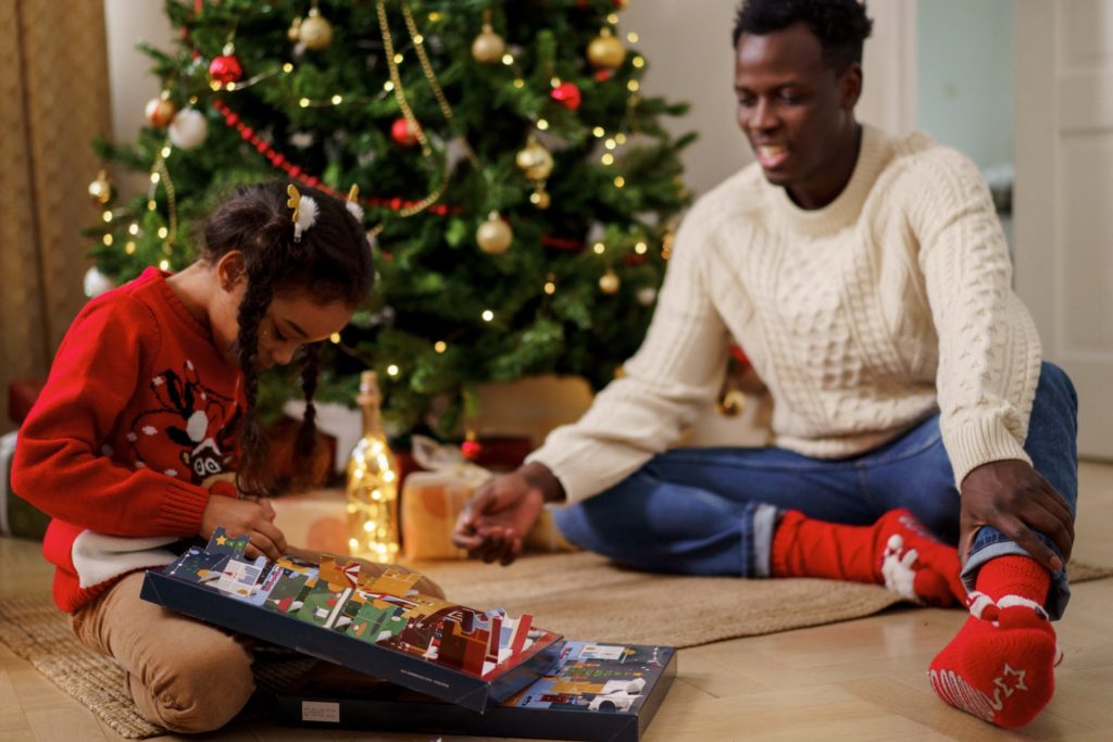 Child opening advent calendar